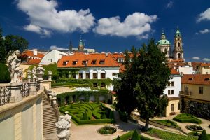 Amazing garden with its green fence and white statues